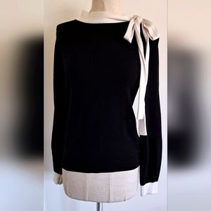 Black sweater with a white side bow